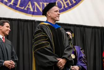 Mitch Metzger accepts Trustees' Distinguished Professor appointment at 2025 spring commencement ceremony.
